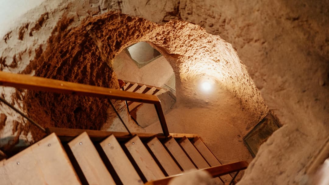 Stairs descending into the depths of the underground city in Cappadocia.